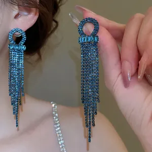 Exquisite silver needle earrings with blue zircons and long tassel drop design
