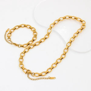 Elegant 18k gold plated geometric chain necklace and bracelet jewelry set on white