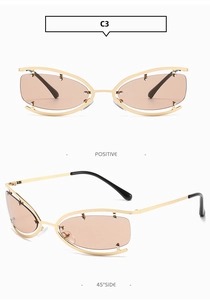 Detail of rimless hollow oval sunglasses with golden metal frame and brown lenses
