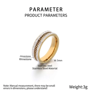 Detail of gold stainless steel ring with double row rhinestones and chain inlay