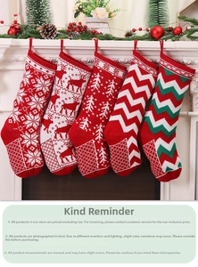 Detailed view of five knitted Christmas stockings with snowflake and reindeer embroidery