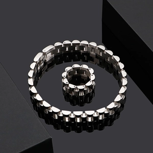 Polished silver titanium steel watchband bracelet and ring set on black luxury gift box
