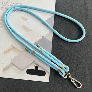 Detail of blue 8mm braided phone lanyard with silver metal adjustment rings and hooks