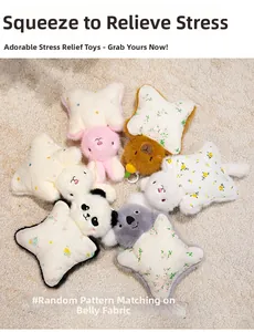 Close-up of colorful plush star dolls with random belly patterns on soft carpet
