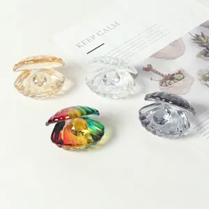 Artistic crystal seashell figurines with pearl gemstones in four elegant gradient colors