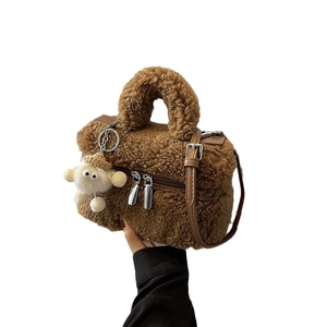 Brown faux shearling square tote bag with lamb plush charm and matching shoulder strap