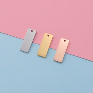 Mirror polished rectangular stainless steel jewelry tags in silver, gold, and rose gold finishes