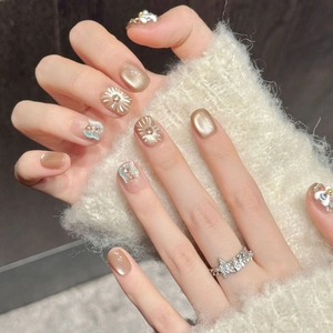 Golden lion manicured press-on nails with 3D pearls and star accessories for New Year