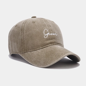 Retro washed cotton baseball cap in tan featuring white Groom embroidery on the front