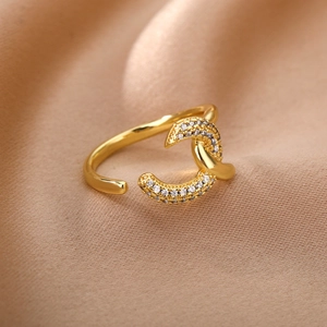Macro shot of double-layer gold-plated adjustable ring on silk fabric with micro zircons