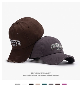 Detail of vintage baseball cap with ANGELES 1994 embroidery and distressed brim edge