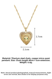 Detailed view of gold lion heart pendant with dimensions and green zircon eye accents