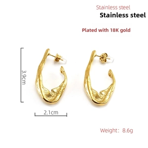 Detail view of gold 18K plated stainless steel irregular wavy earrings with measurements