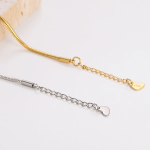 Gold and silver snake chain bracelet with heart charm and life lock pendant