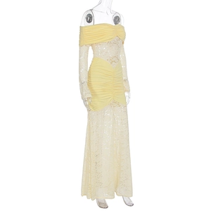 Detail of floral lace texture and off-shoulder smocked neckline on a yellow maxi dress