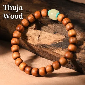 Thuja wood bracelet with natural grain, jade-like bead and turquoise accents