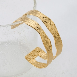 Chic gold textured open cuff bracelet with irregular hammered metal finish for women