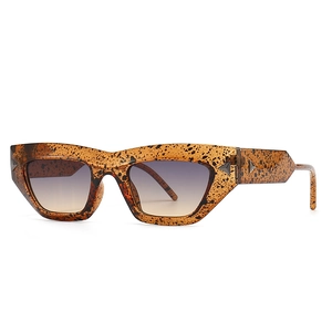 Chic amber tortoise shell cat eye sunglasses with gradient lenses at a 45-degree angle