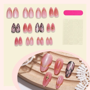 Pink cat eye press-on nails set with gold French tips and butterfly wing designs