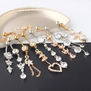 Mix of gold and silver navel rings set with heart and butterfly cubic zirconia designs