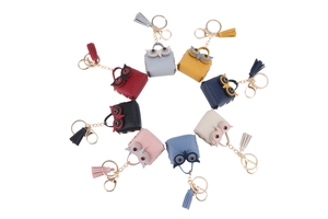 Collection of owl mini coin purse keychains with tassels in eight assorted colors