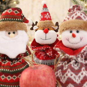 Knitted Christmas gift bags with 3D Santa, reindeer, and snowman plush decorations