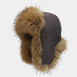 Close-up of winter aviator hat with thick brown faux fur lining and suede exterior