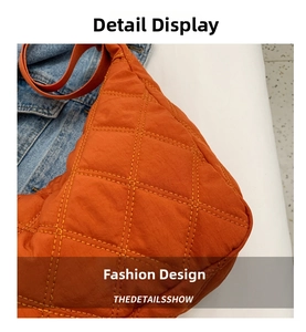 Detailed view of orange quilted tote bag featuring classic diamond stitching and puffy fabric