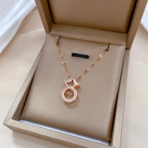 Rose gold bunny pendant necklace with dancing stone in a jewelry box