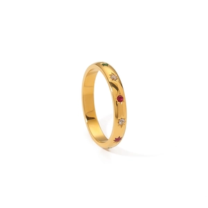 Gold stainless steel ring with colorful star-set zircons shown from a side view