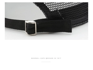 Detail of black mesh baseball cap showing adjustable strap and silver metal buckle