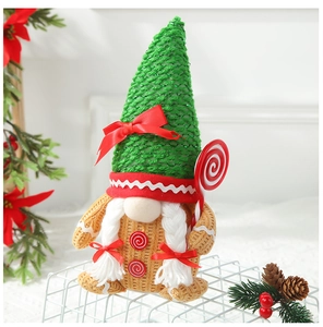 Detail of Christmas gnome with braided hair, knitted hat and a candy cane accessory