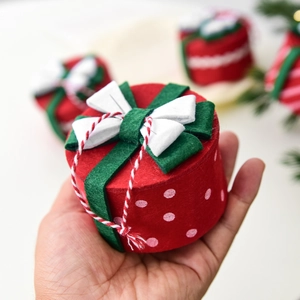Mini red felt Christmas gift box ornament with white polka dots and a tricolor bow