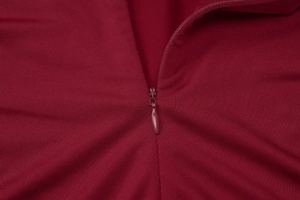 Detail shot of the back hidden zipper closure on this elegant burgundy summer dress