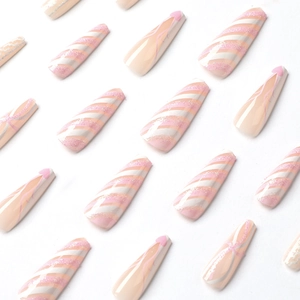 Pink and white coffin press-on nails with glitter stripes and minimalist heart designs
