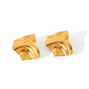 Detail of 18K gold stainless steel earrings with irregular hammered texture and reflections