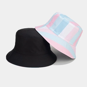 Detail shot of a black and colorful striped reversible bucket hat with clean texture