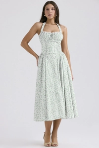 Detail of floral halter dress featuring white lace trim and a delicate bow on the neckline