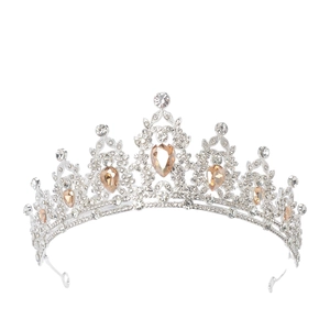 Detailed view of silver crown featuring luxury clear and champagne crystals for wedding