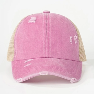 Front view of pink distressed cotton baseball mesh cap with vintage torn hole detail