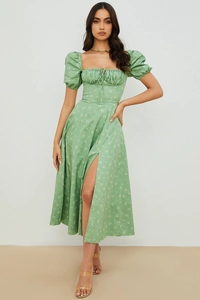 Detail of square neckline with lace-up chest and puff sleeves on floral maxi dress