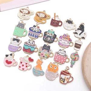 Macro view of assorted enamel cat and coffee cup charms for DIY jewelry making