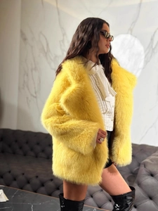 Chic yellow faux fur coat with oversized lapel and long plush texture for women