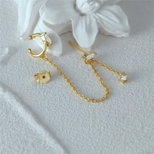 Detailed shot of 925 silver gold-plated chain earrings with opal and marquise zircon stones