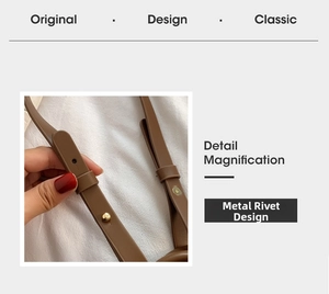 Détail de la bandoulière réglable en cuir marron avec rivet en métal doré brillant