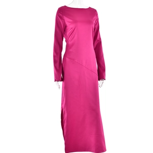 Detail view of hot pink satin gown featuring elegant side slit and sleek fabric texture