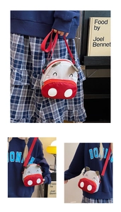 Detail of cute red cartoon calf toddler bag with adjustable strap and 3D ears
