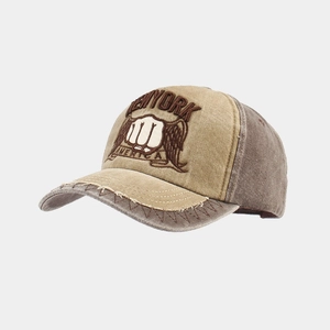 Detail of vintage washed canvas baseball cap featuring fist embroidery and Z-shaped stitching