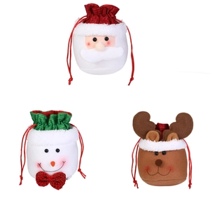 Christmas drawstring gift bags featuring 3D Santa, snowman, and reindeer fabric designs