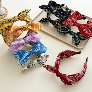 Women paisley print bow headbands in various colors including red, blue and yellow